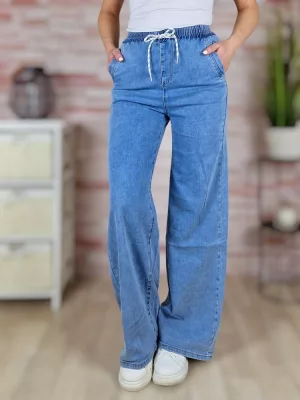   Gumis derekú, bő és hosszú szárú, világoskék farmernadrág XS-XL-ig